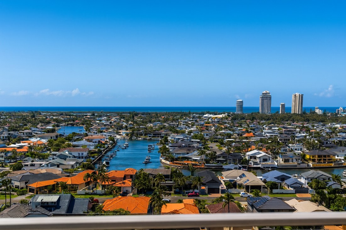 Runaway Bay, QLD, Aerial view of residential canals and buildings