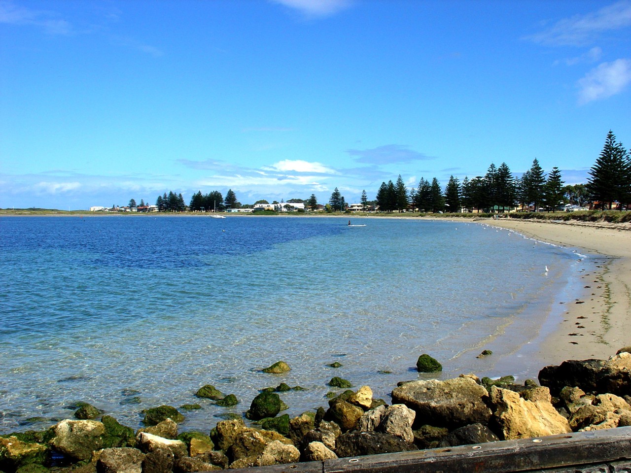 Safety Bay, WA, Shoreline with rocks and distant buildings