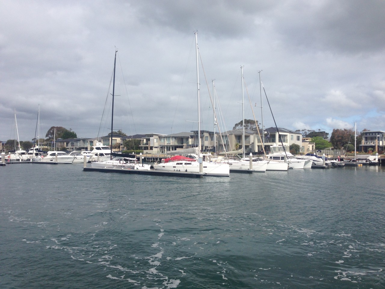Safety Beach, VIC, Yachts docked at a marina under cloudy skies