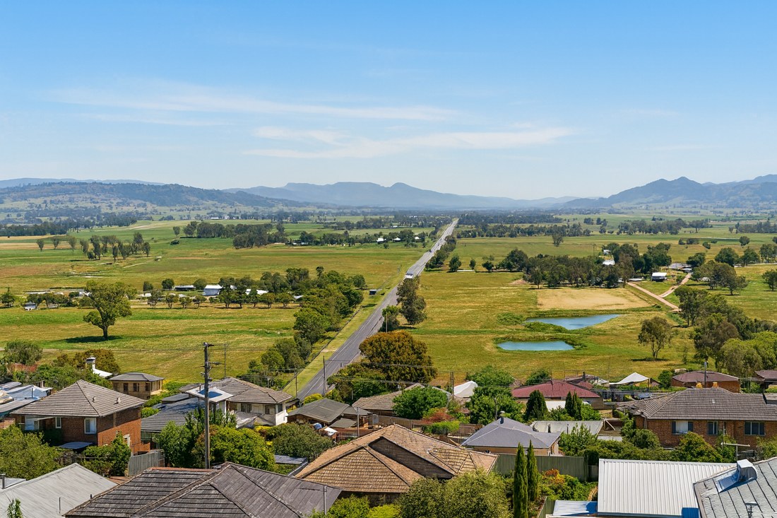 Scone, NSW, Countryside view with houses and distant hills