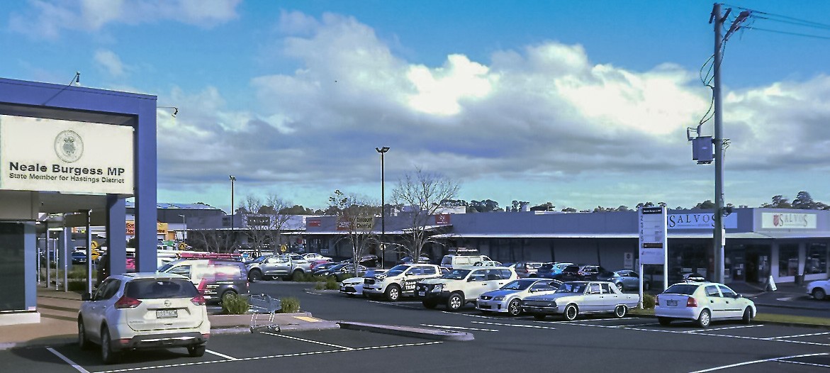 Somerville, VIC, Shopping centre with parked cars and stores