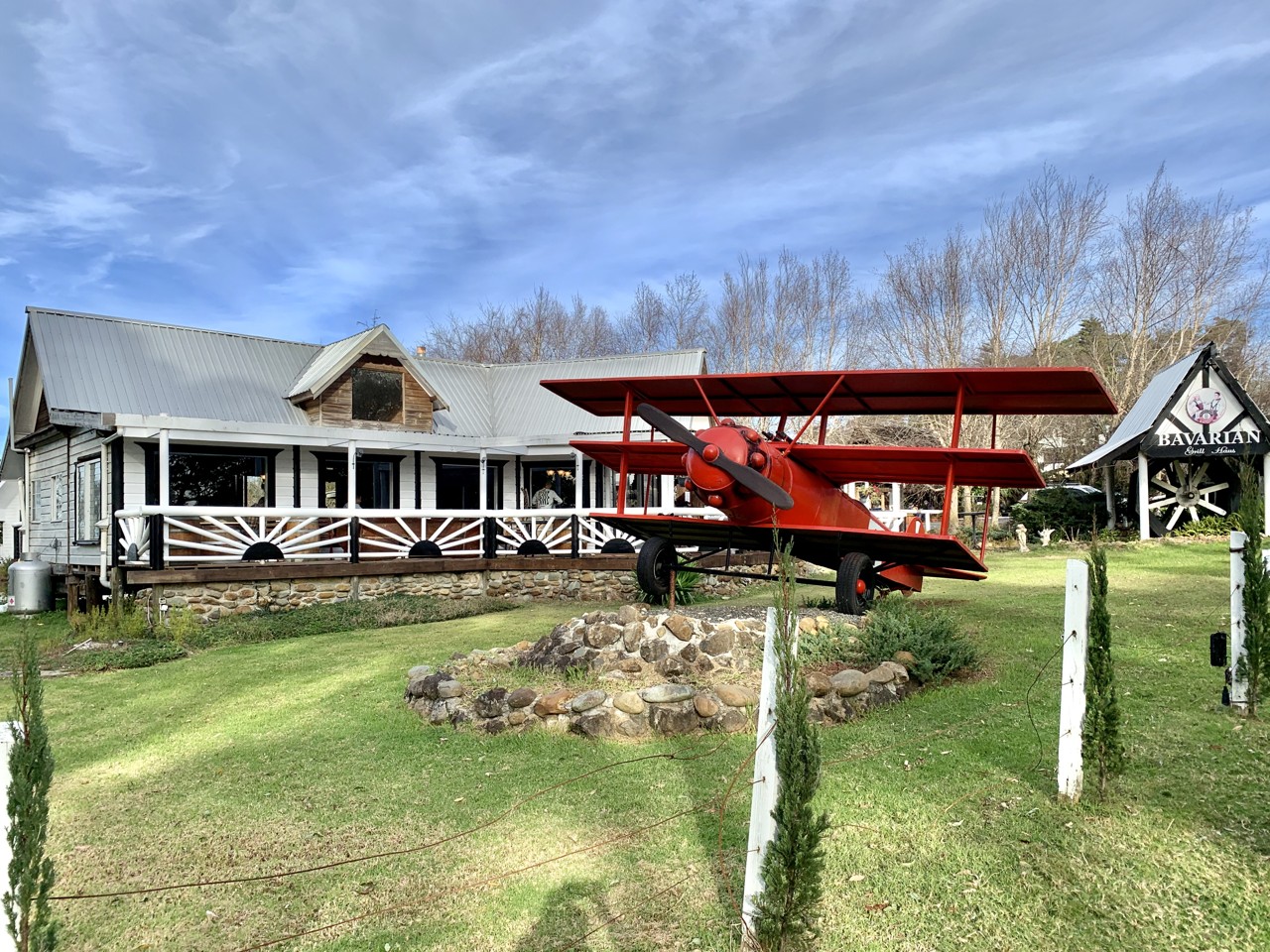 Tamborine Mountain, QLD, Replica red biplane outside a rustic cafe