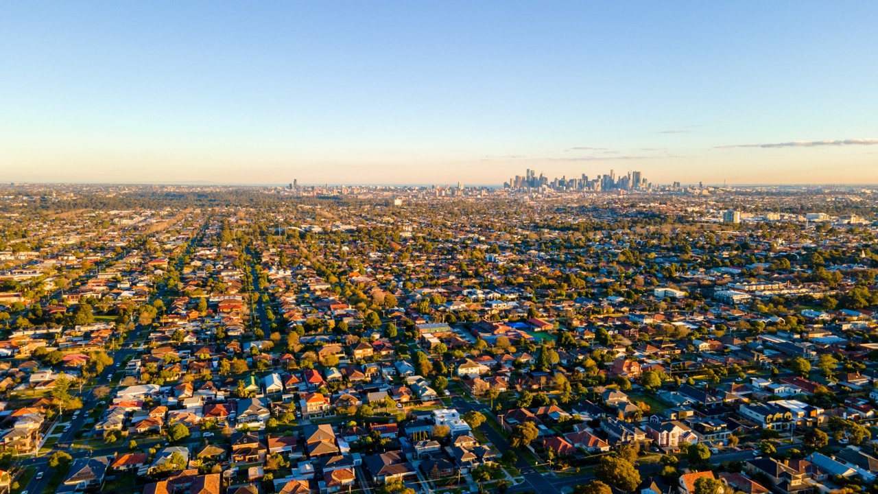 Thornbury, VIC, Aerial view of suburban houses and city skyline