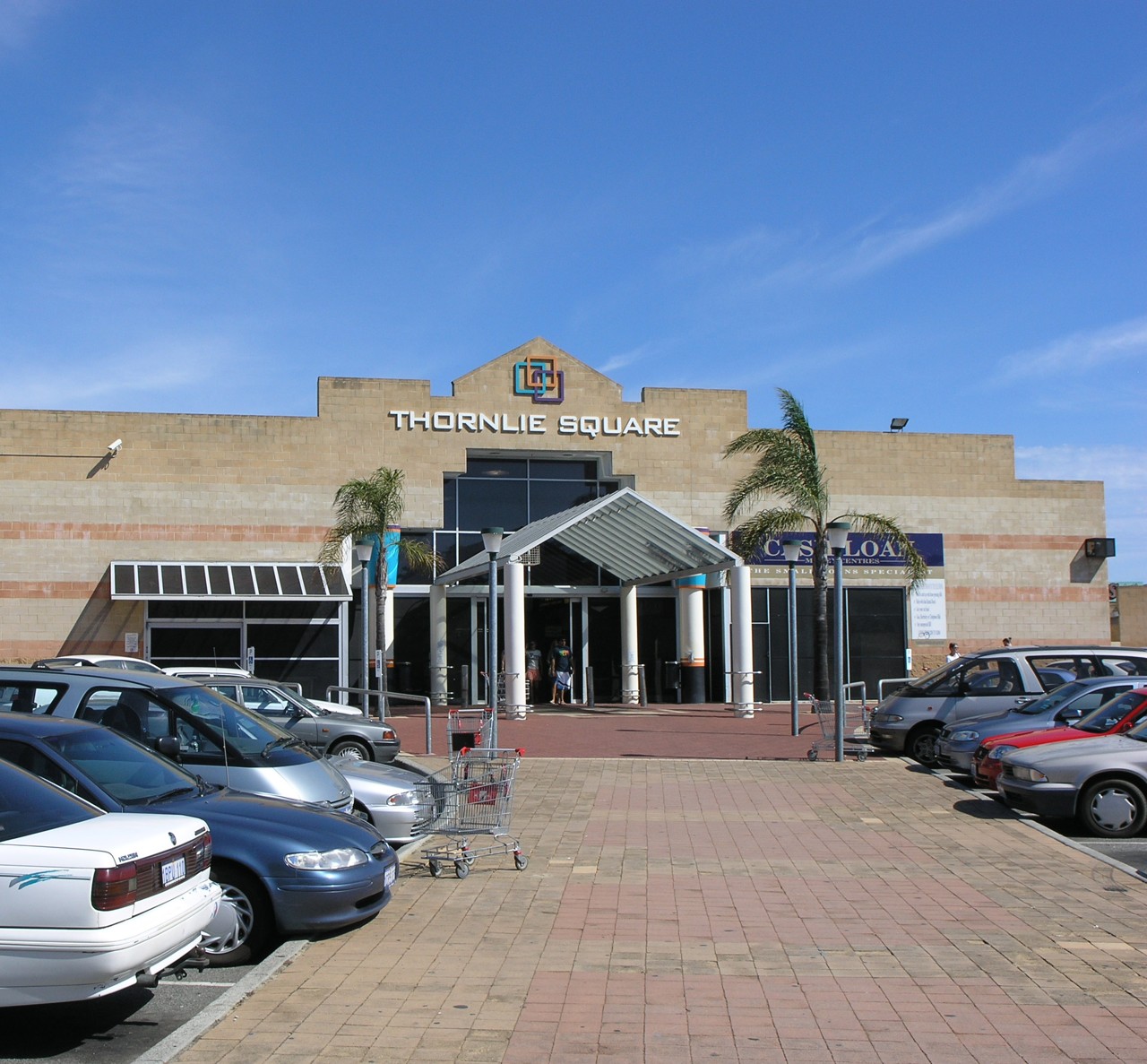 Thornlie, WA, Shopping centre entrance with parked cars