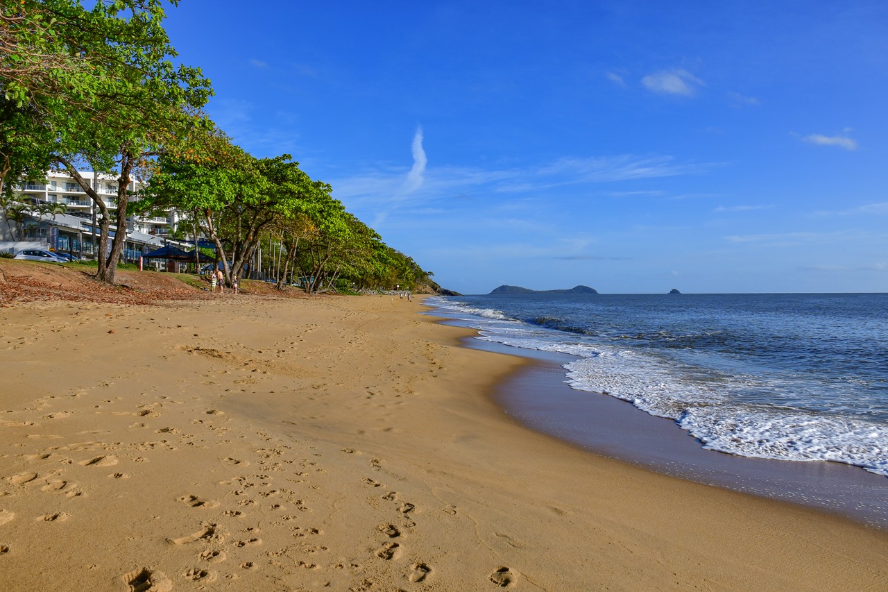 Trinity Beach, QLD, Sandy shoreline with ocean and distant islands