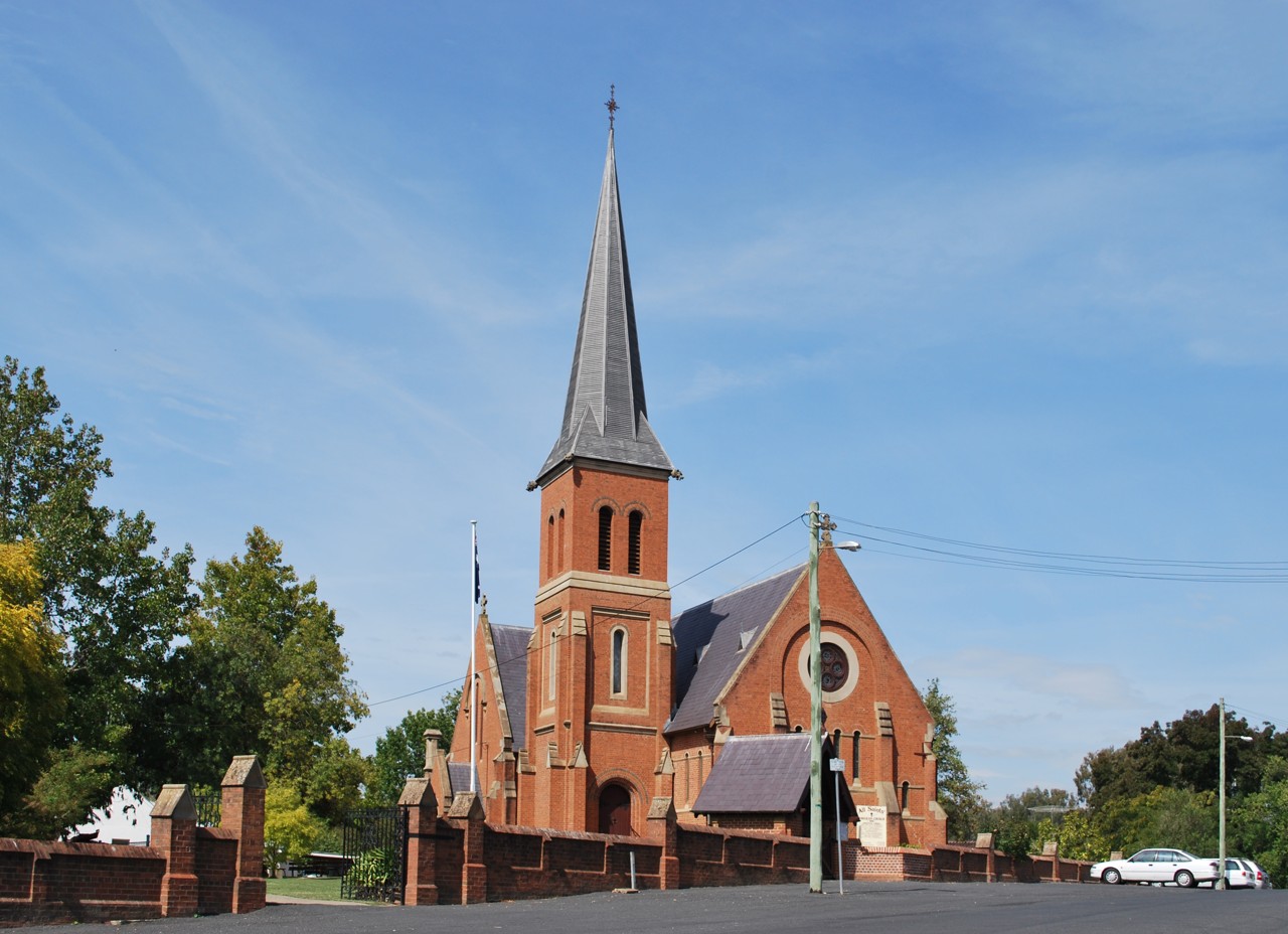 Tumut, NSW, Red brick church with tall steeple on street