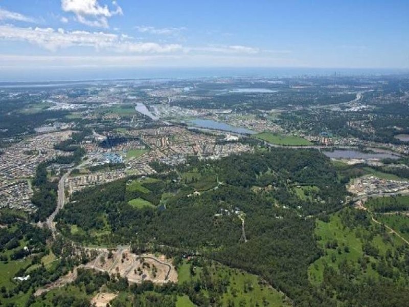 Upper Coomera, QLD, Aerial view of residential and green areas