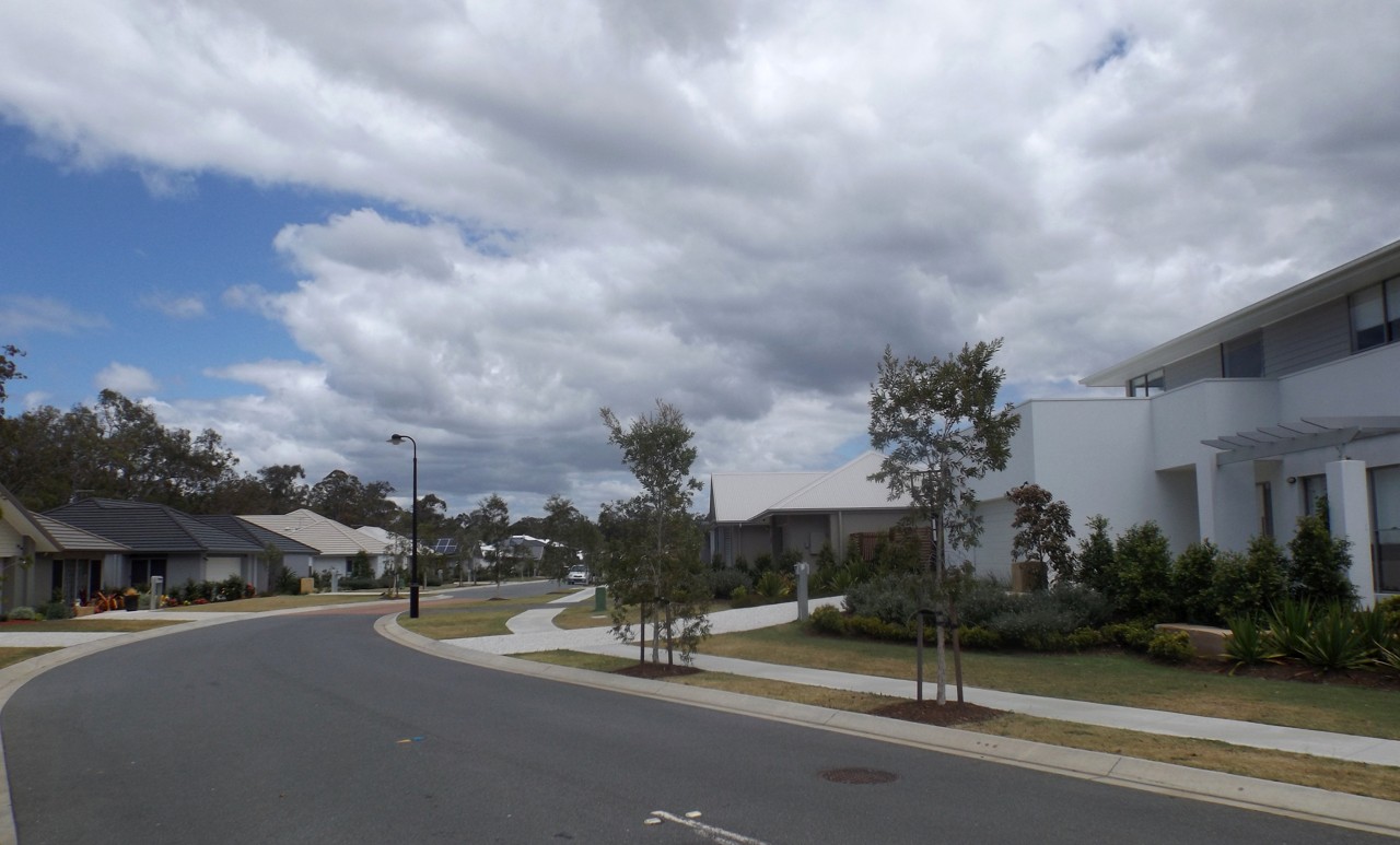 Wakerley, QLD, Suburban street with modern houses and trees