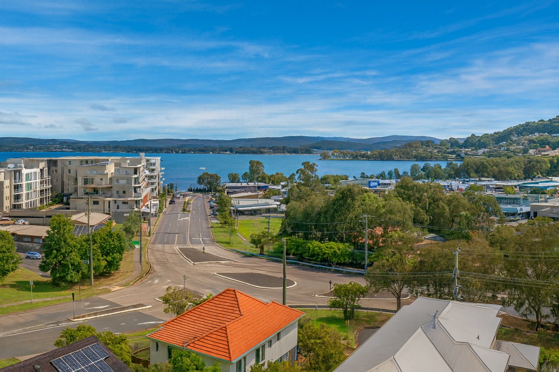 Warners Bay, NSW, Lakefront buildings and streets with water view