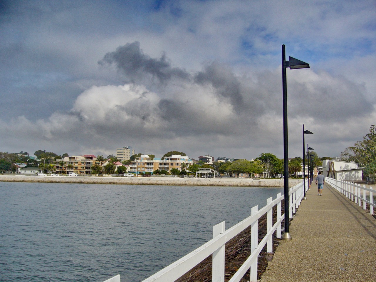 Wynnum, QLD, Waterfront path with distant residential buildings