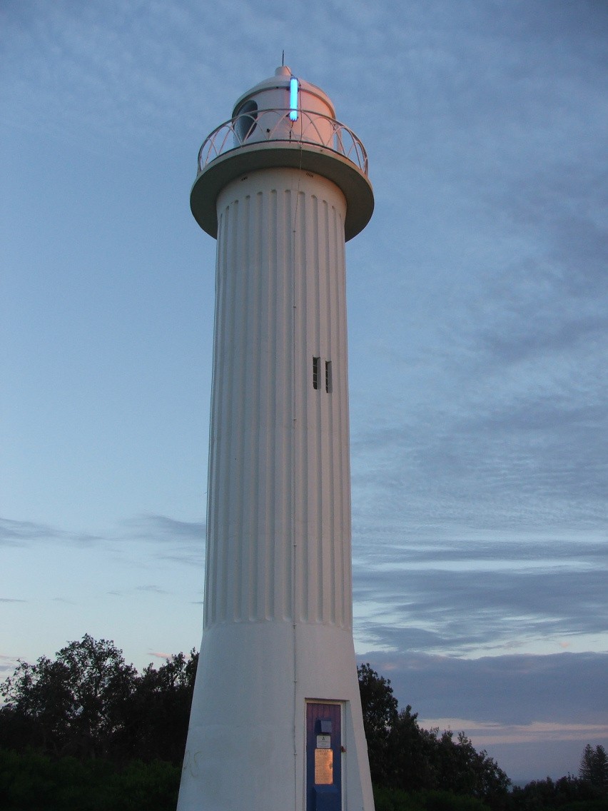 Yamba, NSW, White lighthouse against evening sky