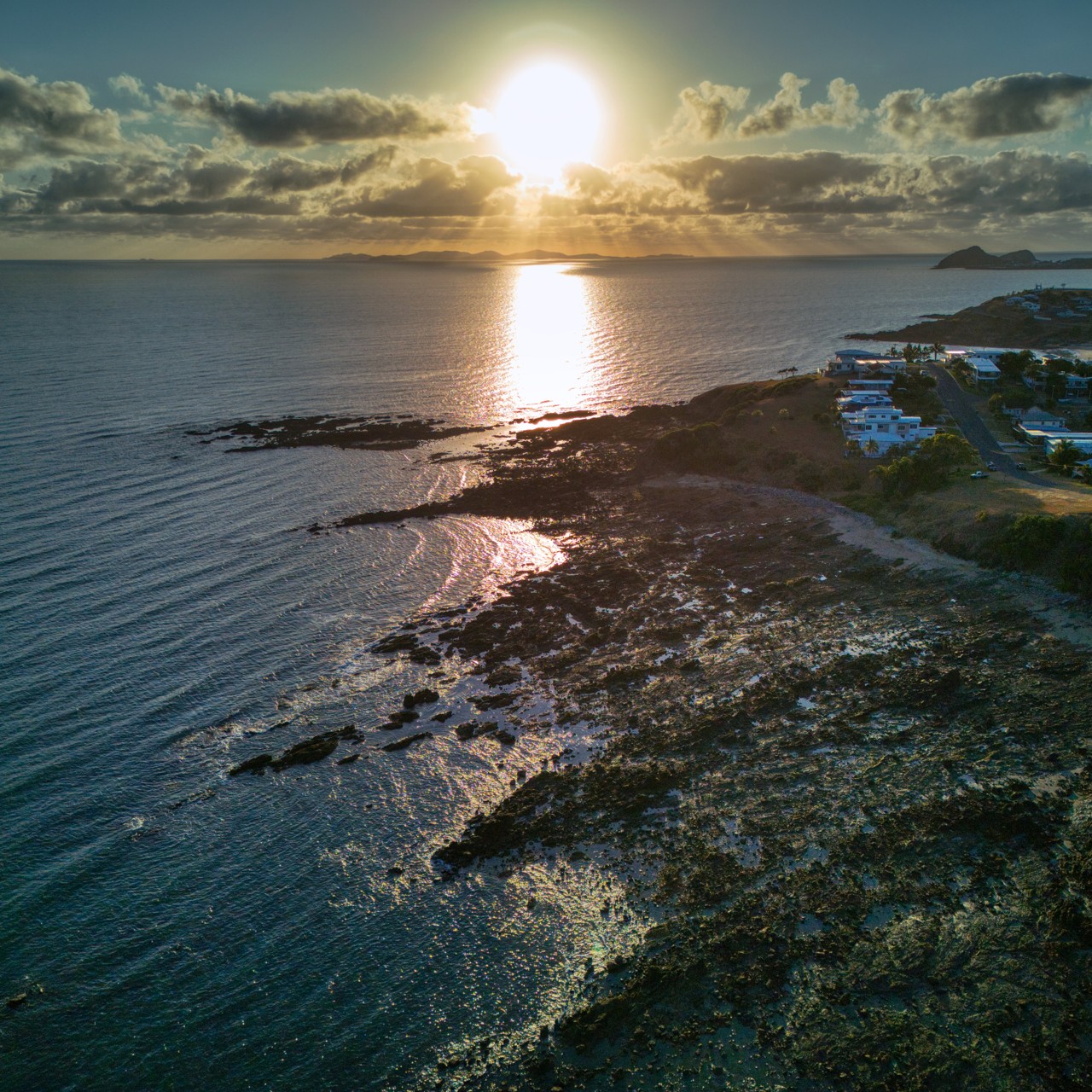 Yeppoon, QLD, Rocky coastline with sun setting over ocean