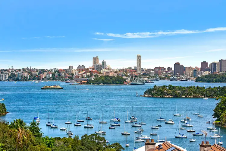 The wide harbour panorama from 16 Clanalpine Street, Mosman: Mosman Bay, a Sydney ferry and the city skyline